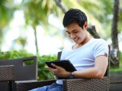 man holding tablet